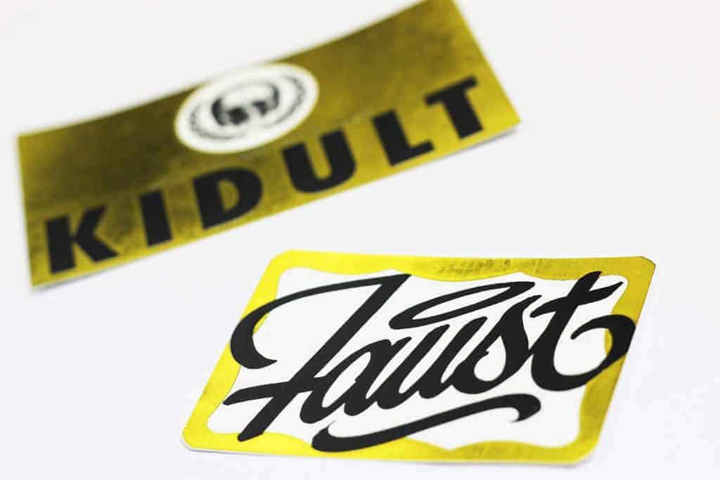 " Faust and Kidult was one of our first batches of custom stickers with gold foil effect. And, of course, much respect to both guys."